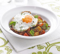 Potato, pepper & chorizo stew with fried eggs recipe | BBC Good Food